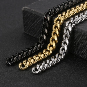 Close-up of polished stainless steel Cuban chains in black, gold, and silver finishes