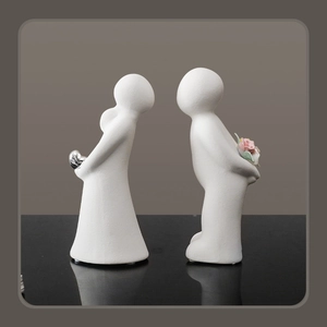 Abstract ceramic couple figurines with matte white finish and pink porcelain flower decor