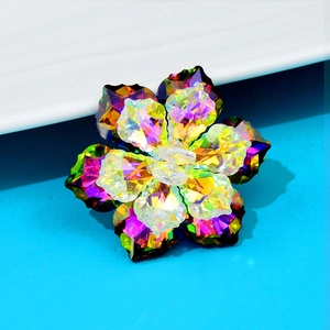 Exquisite iridescent crystal flower brooch with heart-shaped petals in a gold metal setting