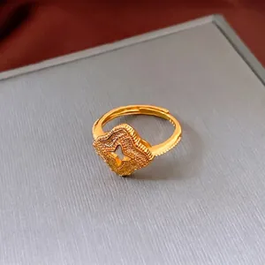 Vintage gold plated adjustable clover ring with frosted texture and hollow star design