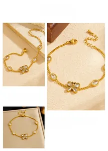 Detailed view of the gold-plated butterfly bracelet featuring claw-set crystals and lobster clasp