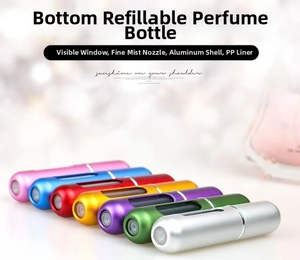 Detail view of colorful 5ml portable perfume atomizers with visible window and refillable bottom