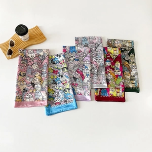 Elegant 90cm square satin silk scarves with colorful cat patterns on a wooden tray