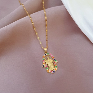 Detailed macro view of Hand of Fatima pendant with micro-inlaid colored zircons and relief