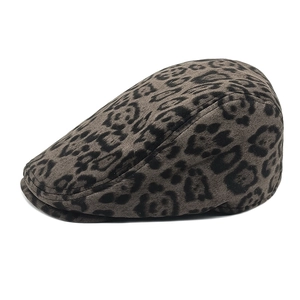 Detailed view of leopard print texture and fine stitching on a suede ivy cap