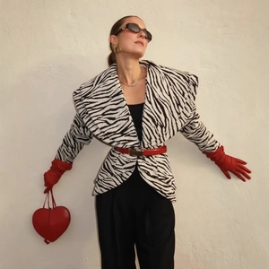Zebra print coat set with red heart bag and accessories in a stylish full-body model pose