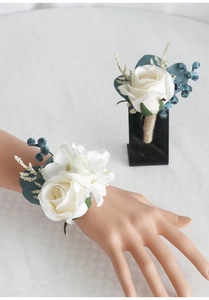 Detailed set of white rose corsage and wristlet with navy berries and hemp rope wrap