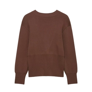 Detailed view of brown knit cardigan with ribbed cuffs and crew neck collar
