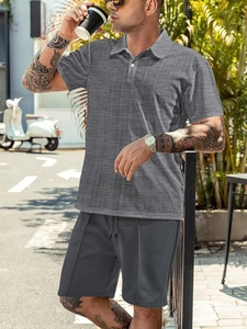Detail view of men's casual two-piece grey polo set featuring a subtle checkered texture