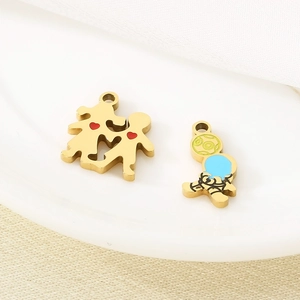 Golden stainless steel boy and girl charms with colorful red and blue enamel hearts
