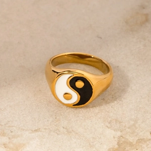 Detailed close-up of a gold-plated stainless steel ring with a Yin Yang enamel design.
