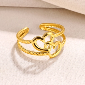 Gold double heart open ring with twisted rope texture band in a minimalist style