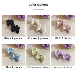 Detail display of small satin bow hair clips in six colors with soft silk texture