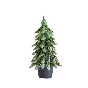 Mini frosted Christmas tree in a black pot with white snow tips for desktop decor