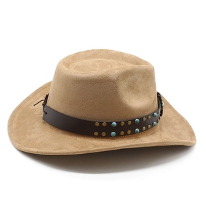 Detail of camel suede cowboy hat featuring brown leather band with turquoise and metal studs