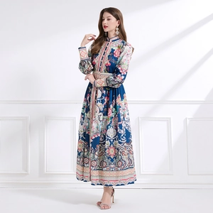 Bohemian maxi dress with floral print, stand collar, and lantern sleeves with belt