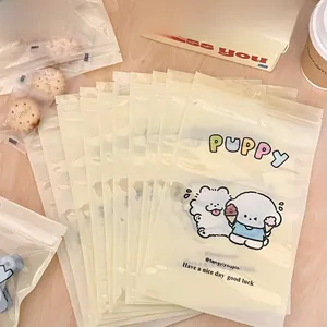 Close-up of translucent puppy themed snack bags on a warm aesthetic wooden tabletop