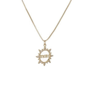 Gold sunburst necklace with mom engraving and shimmering crystals on white background