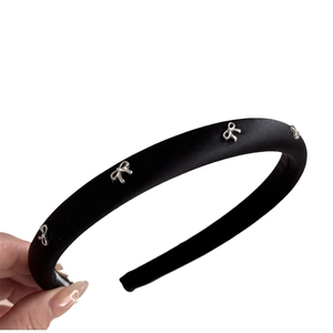 Elegant black satin wide headband with silver metal bow details for women