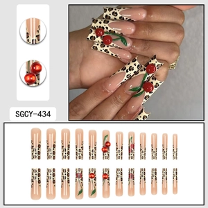 Extra long leopard print and red cherry press-on nails set with 24 pieces in coffin shape