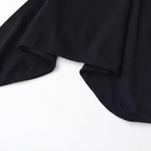 Fashionable black knit cropped top featuring elegant puff sleeves and a textured finish