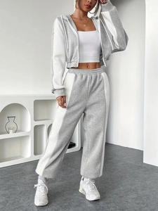 Women's casual gray and white contrast two-piece set with zip-up hoodie and wide-leg sweatpants