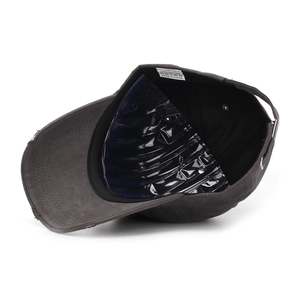 Detail of the 100% cotton inner lining and care label of the grey distressed baseball cap