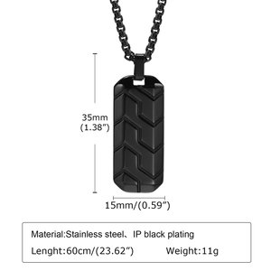 Detail of black stainless steel dog tag necklace with tire pattern and size labels
