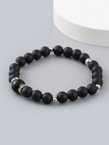 Men's matte black beaded bracelet with silver spacers and gold rhinestone accents