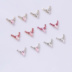 Elegant V-shaped nail art rhinestones set in pink and clear crystal for French manicure