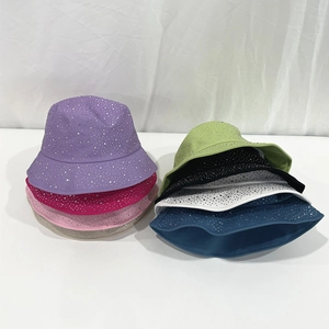 Close-up of sparkling rhinestone cotton bucket hats in various vibrant colors