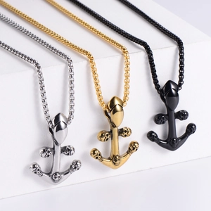 Vintage stainless steel skull anchor pendants in silver, gold, and black finishes