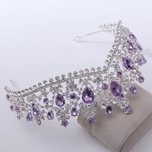 Detail of luxury bridal crown with purple teardrop crystals and silver rhinestone setting