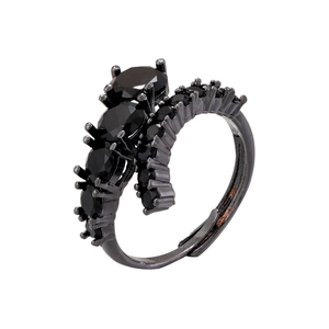 Close-up of black claw-set multi-stone ring featuring double bands and adjustable open ends