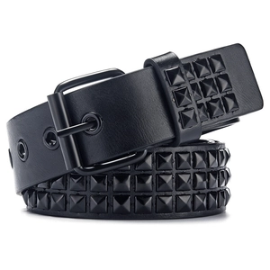 Detail of black punk leather belt featuring three rows of metal pyramid square studs