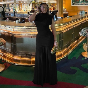 Close-up detail of the waist draping and pleated design on this black sleeveless dress