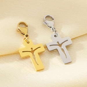 Detailed close-up of hollow Jesus silhouette cross pendants in gold and silver steel