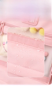 Macro detail of waterproof and tear-resistant pink nylon fabric with water droplets