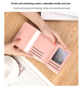 Internal layout of pink and white bi-fold wallet featuring card slots and photo window