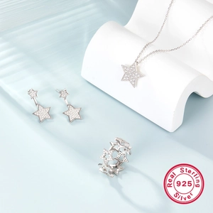 Macro detail of S925 sterling silver star jewelry set featuring fine zircon inlay craftsmanship