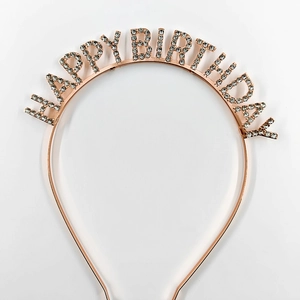 Close-up of rose gold Happy Birthday headband with sparkling rhinestones for parties