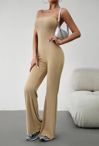 Detail of khaki ribbed knit fabric on a strapless wide-leg jumpsuit with high waist