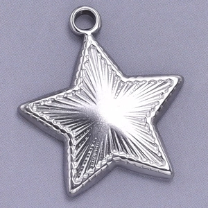 Macro shot of silver 304 stainless steel star pendant with radiant texture details