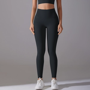 Detail view of high-waist black yoga leggings featuring seamless fabric and a slim-fit design