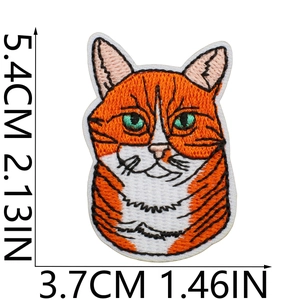 Detail of yellow cat embroidery patch with dimensions 5.4cm height and 3.7cm width