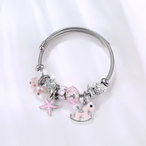 Silver bead bracelet with pink starfish horse charms and crystal beads on white background
