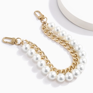 Dual-strand gold chain bag handle with large faux pearls and floral crystal charms