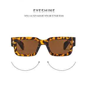Close-up of tortoise shell pattern frame and brown lenses on retro square sunglasses