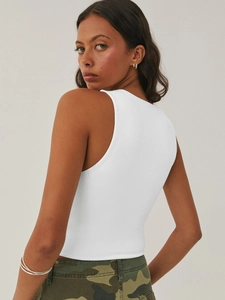 Slim fit white Y2K cropped tank top showing sleeveless back cut and cotton texture