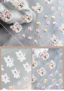 Macro detail of cartoon bear and flower nail stickers with glass-like crystal clear finish